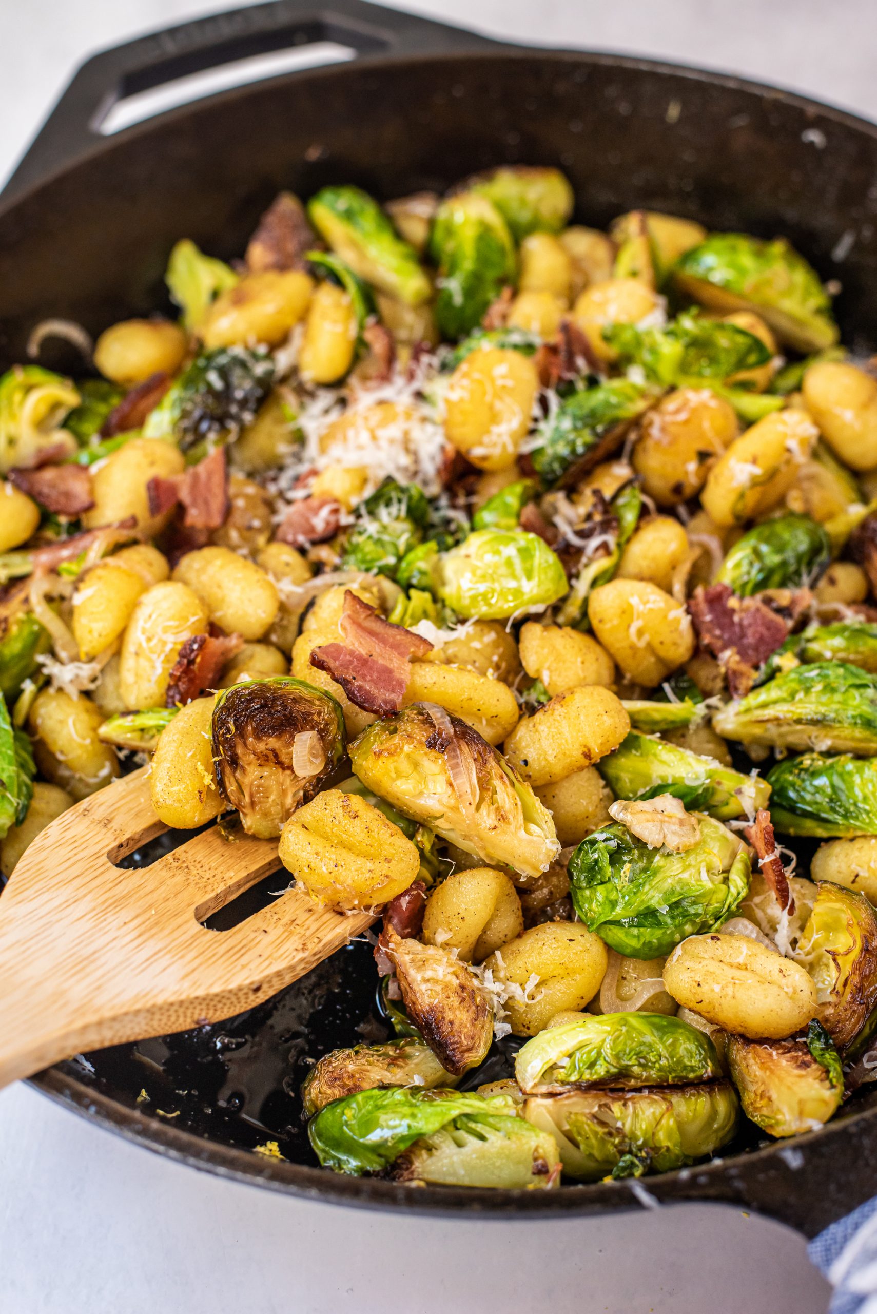 Italian sausage, brussels sprouts and gnocchi are pan fried with lemon zest and butter for a