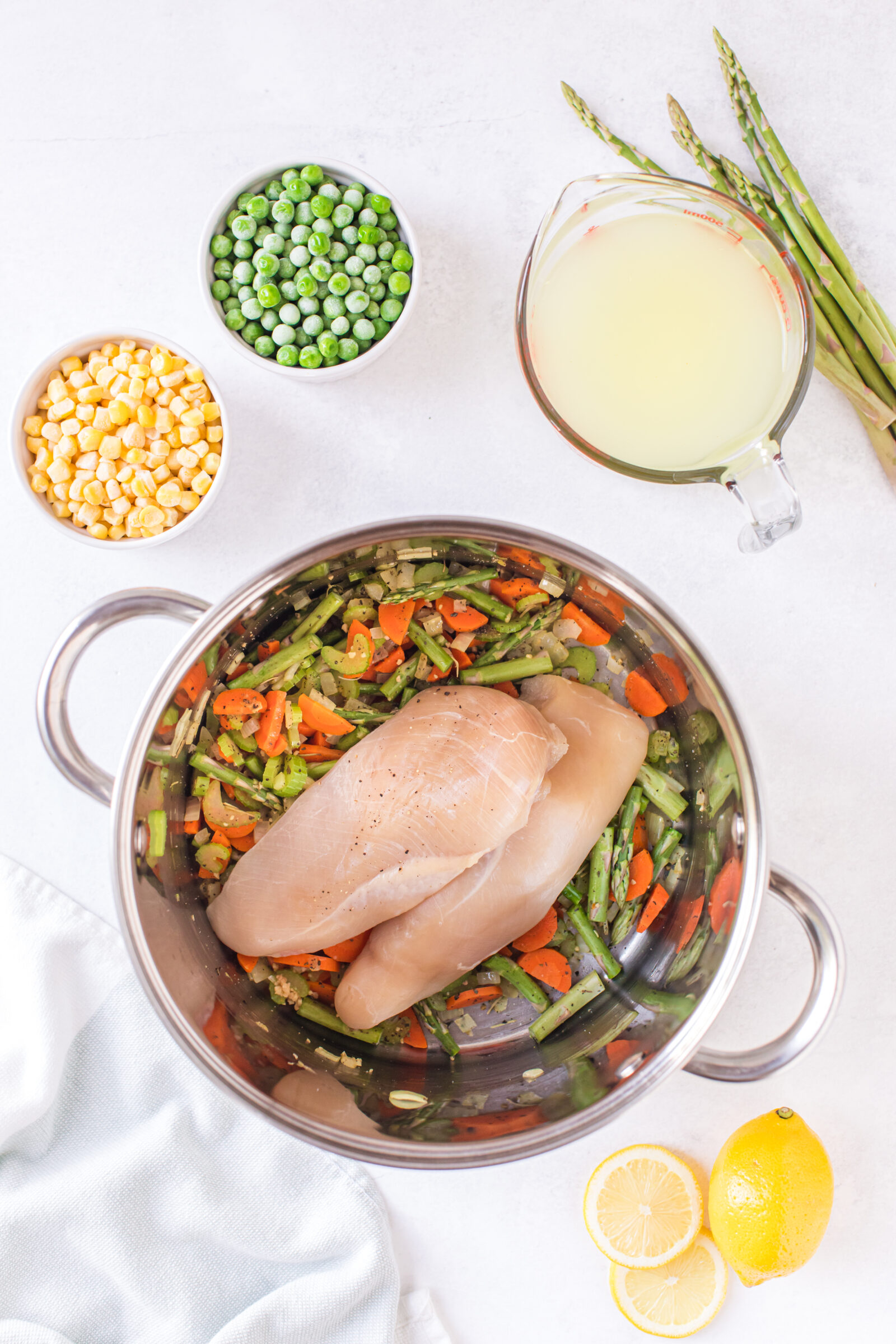 Overhead view of the ingredients needed to make spring chicken asparagus soup