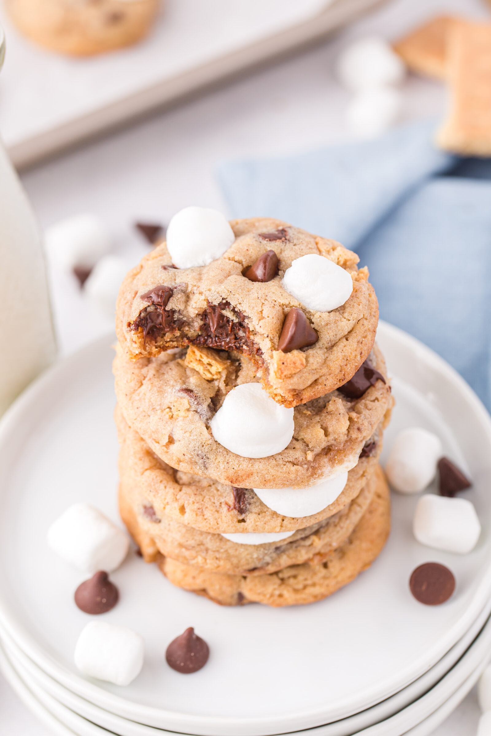 a stack of s'mores cookies on white platte