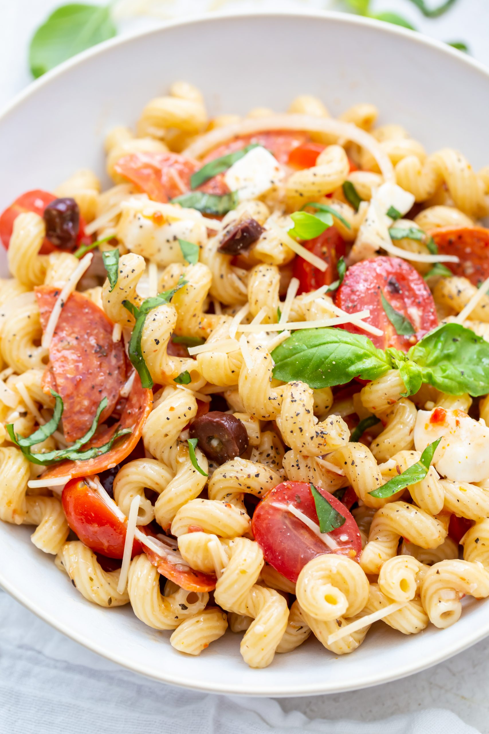 pizza pasta salad in a white bowl