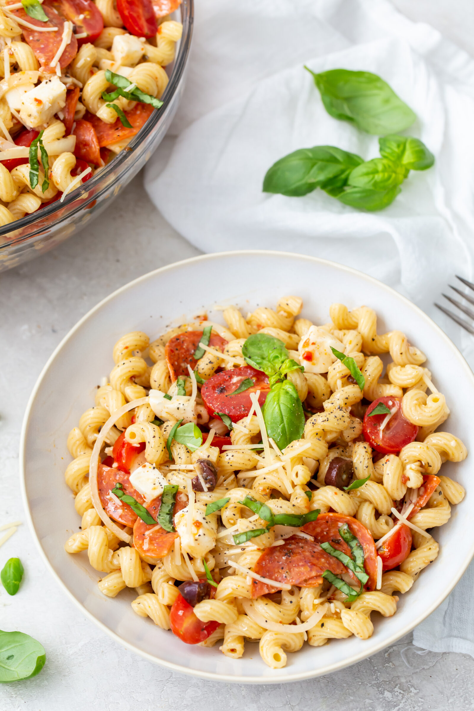 pasta salad in a white bowl