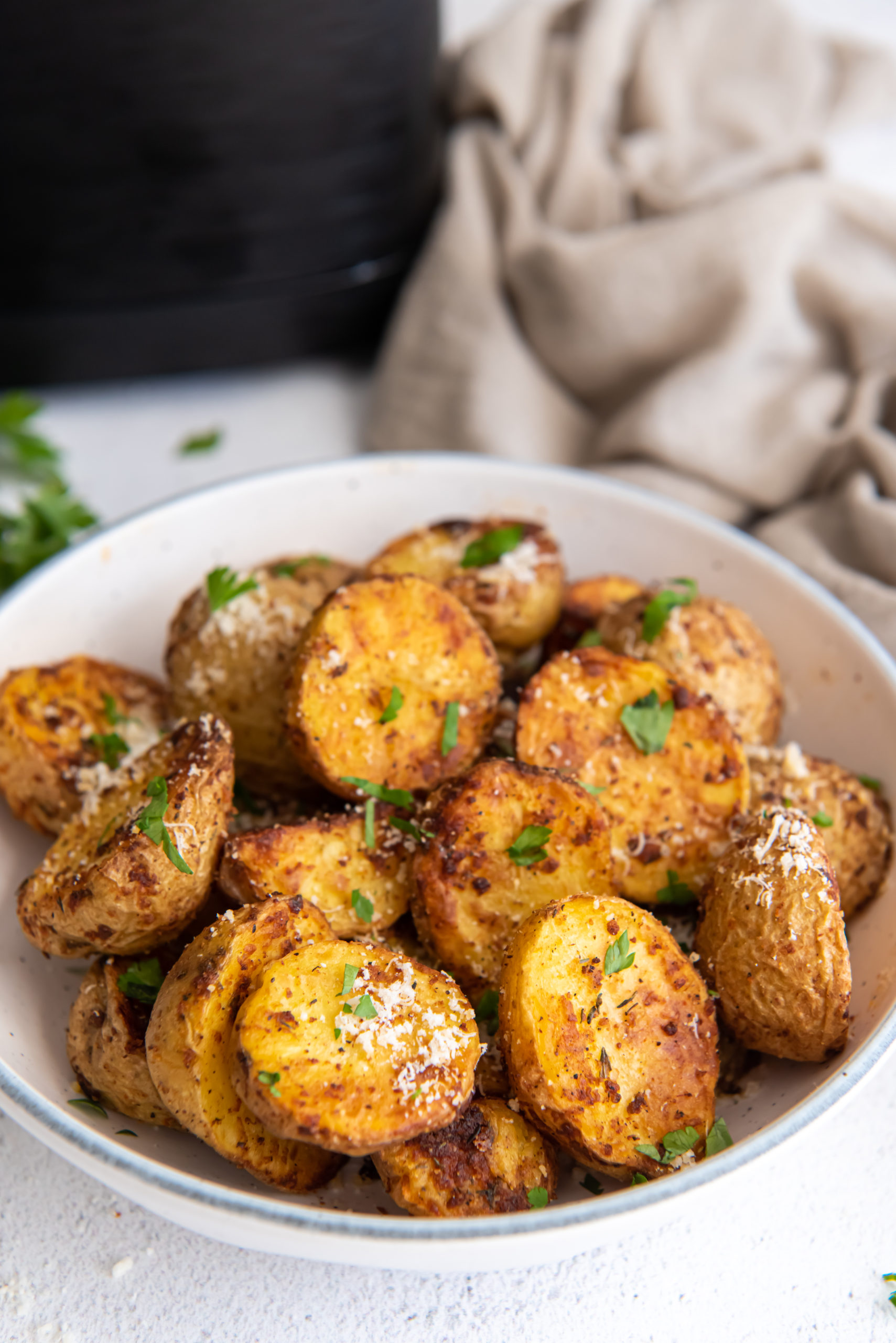 air fryer baby potatoes in a white dish