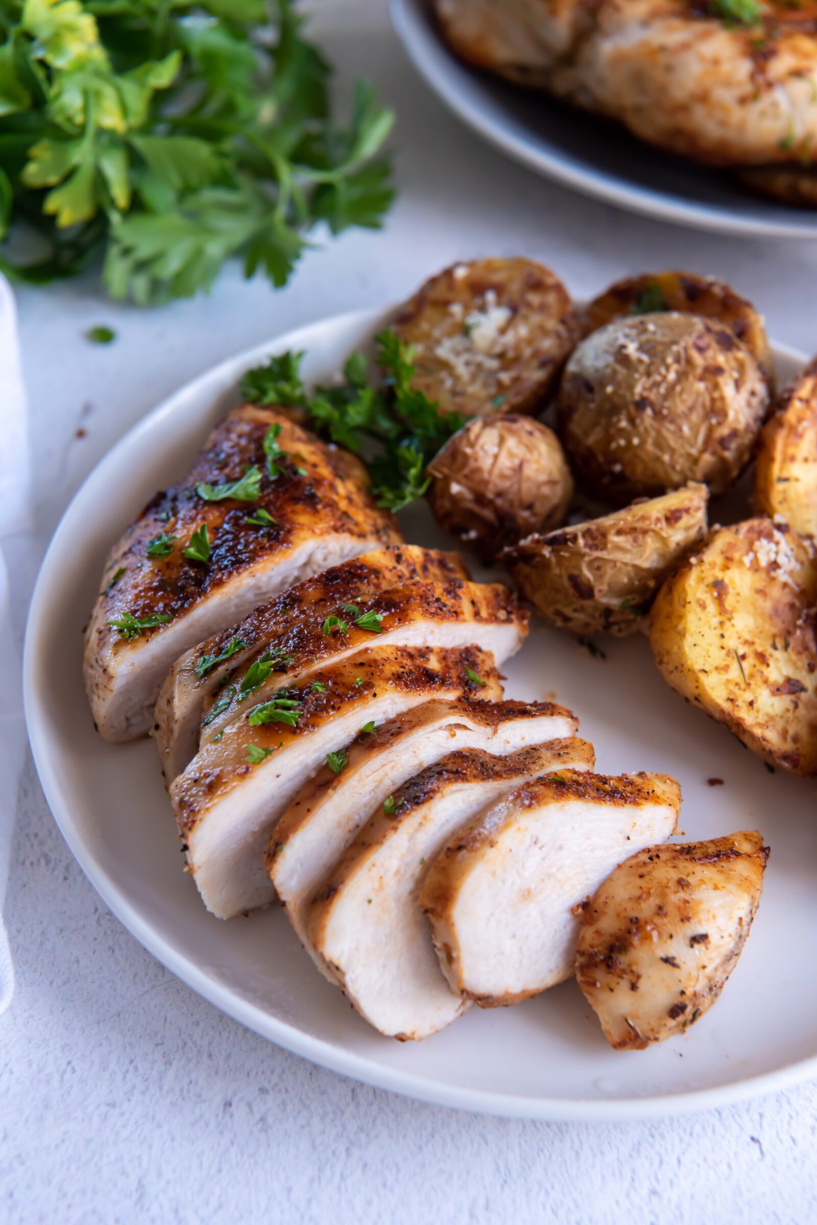 sliced chicken on a white plate