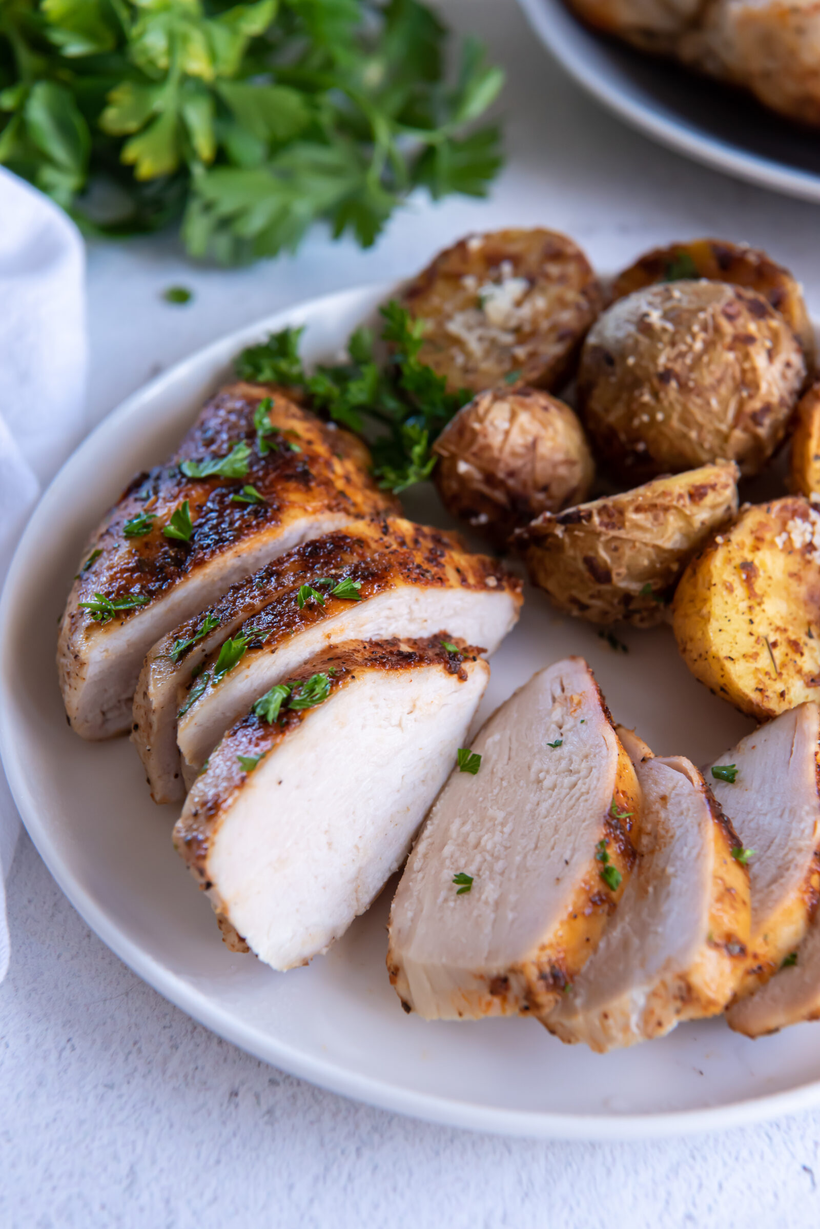 sliced chicken on a white plate