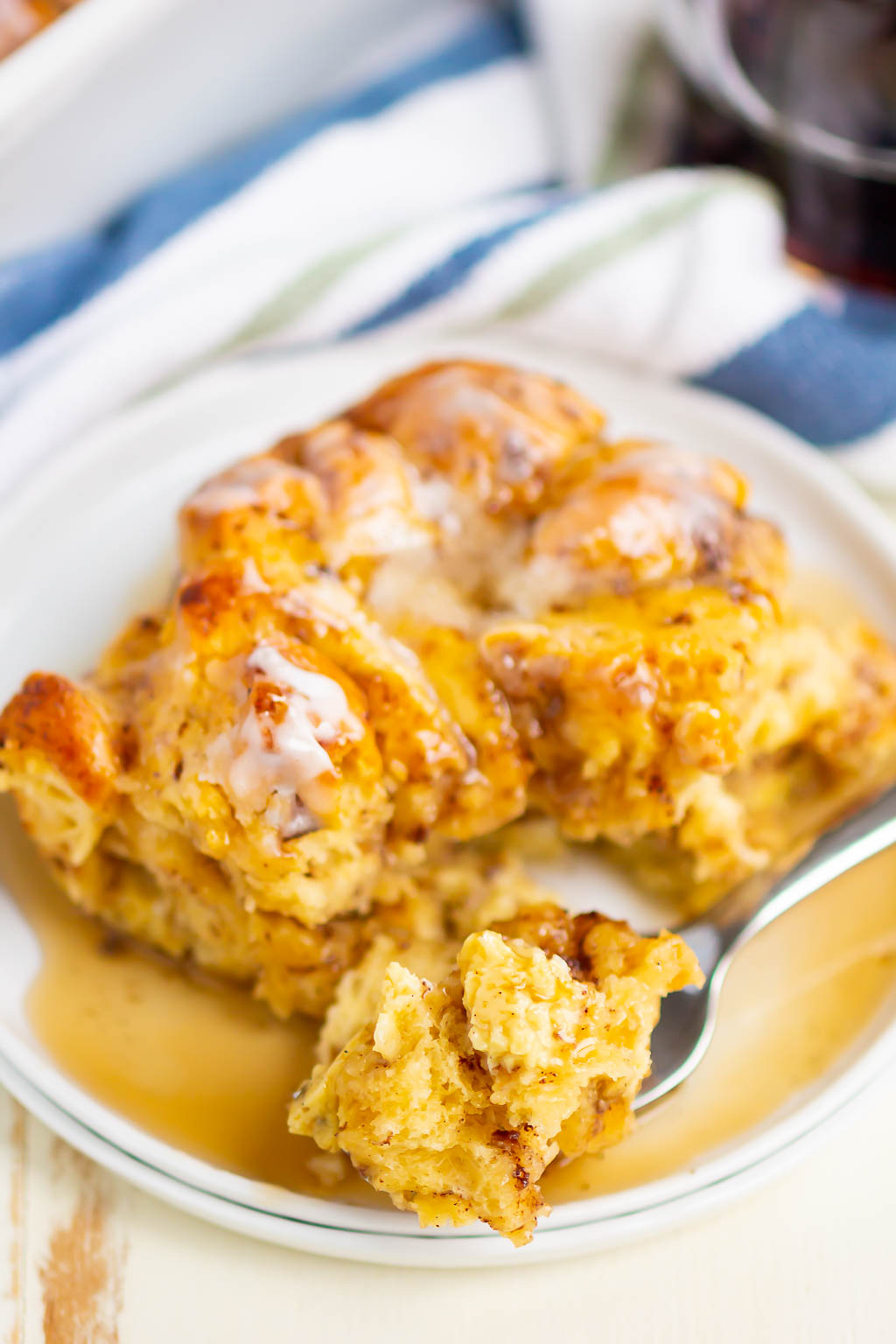 french toast on a white plate with syrup