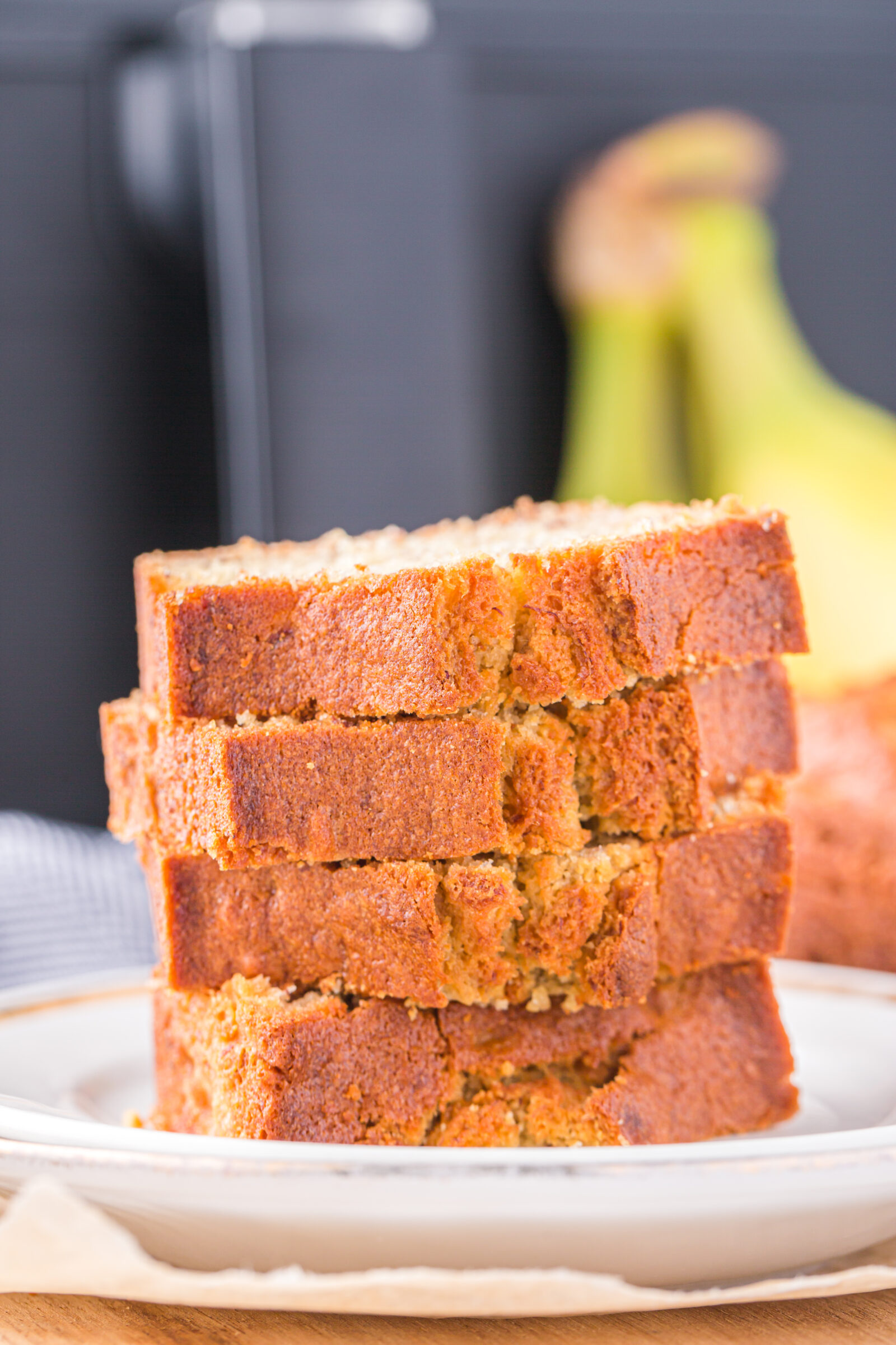 banana bread stacked on a white plate