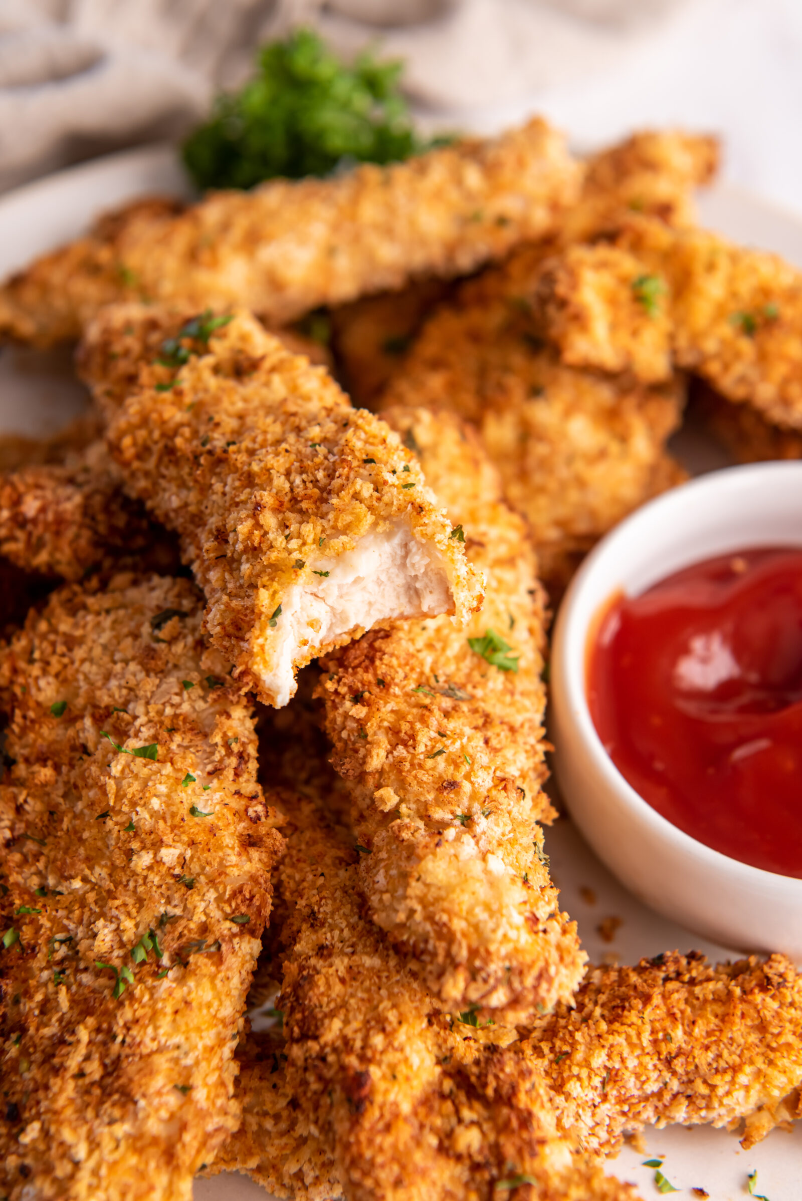 chicken strips on a white plate