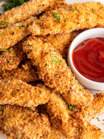 chicken strips on a white plate