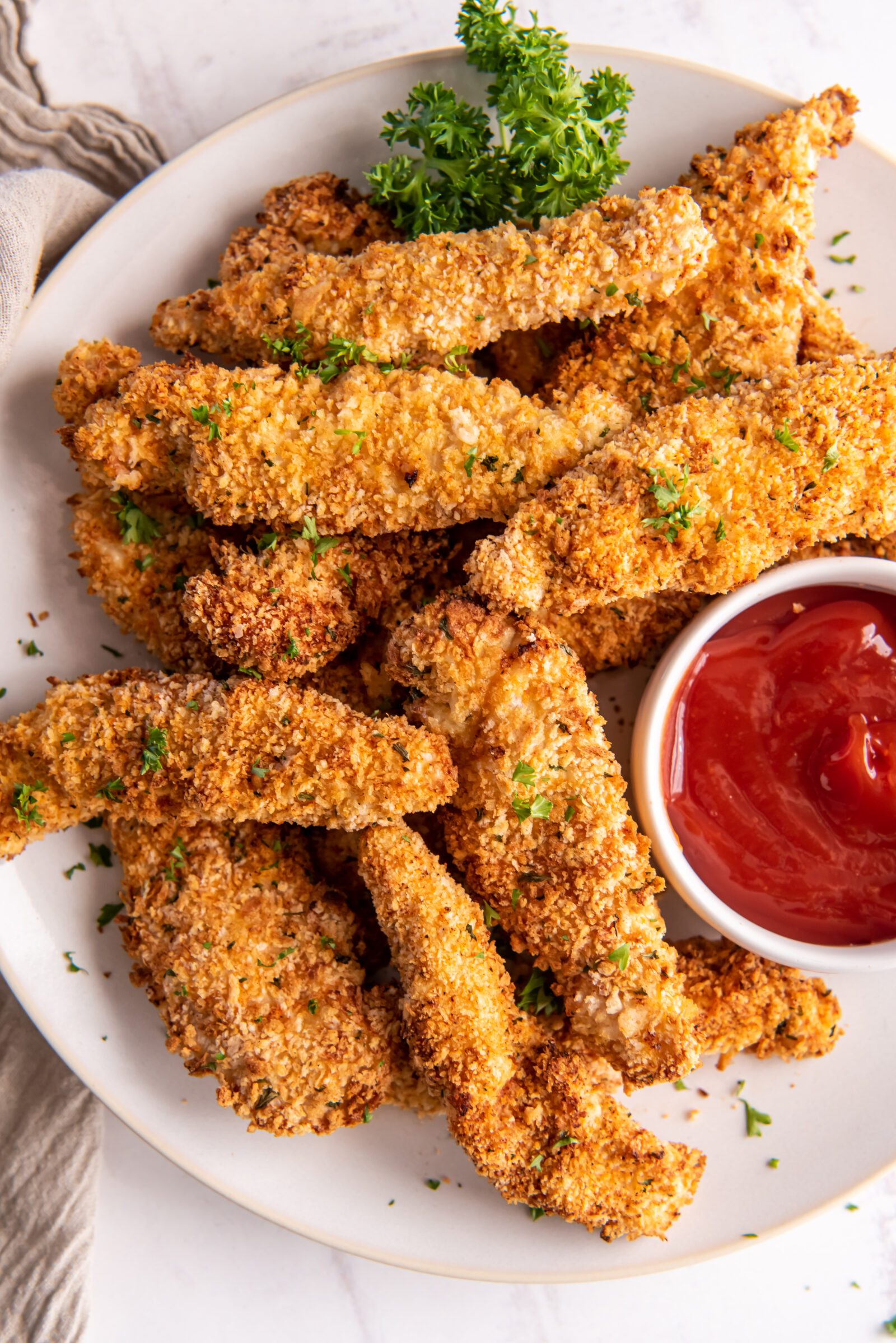 chicken strips on a white plate