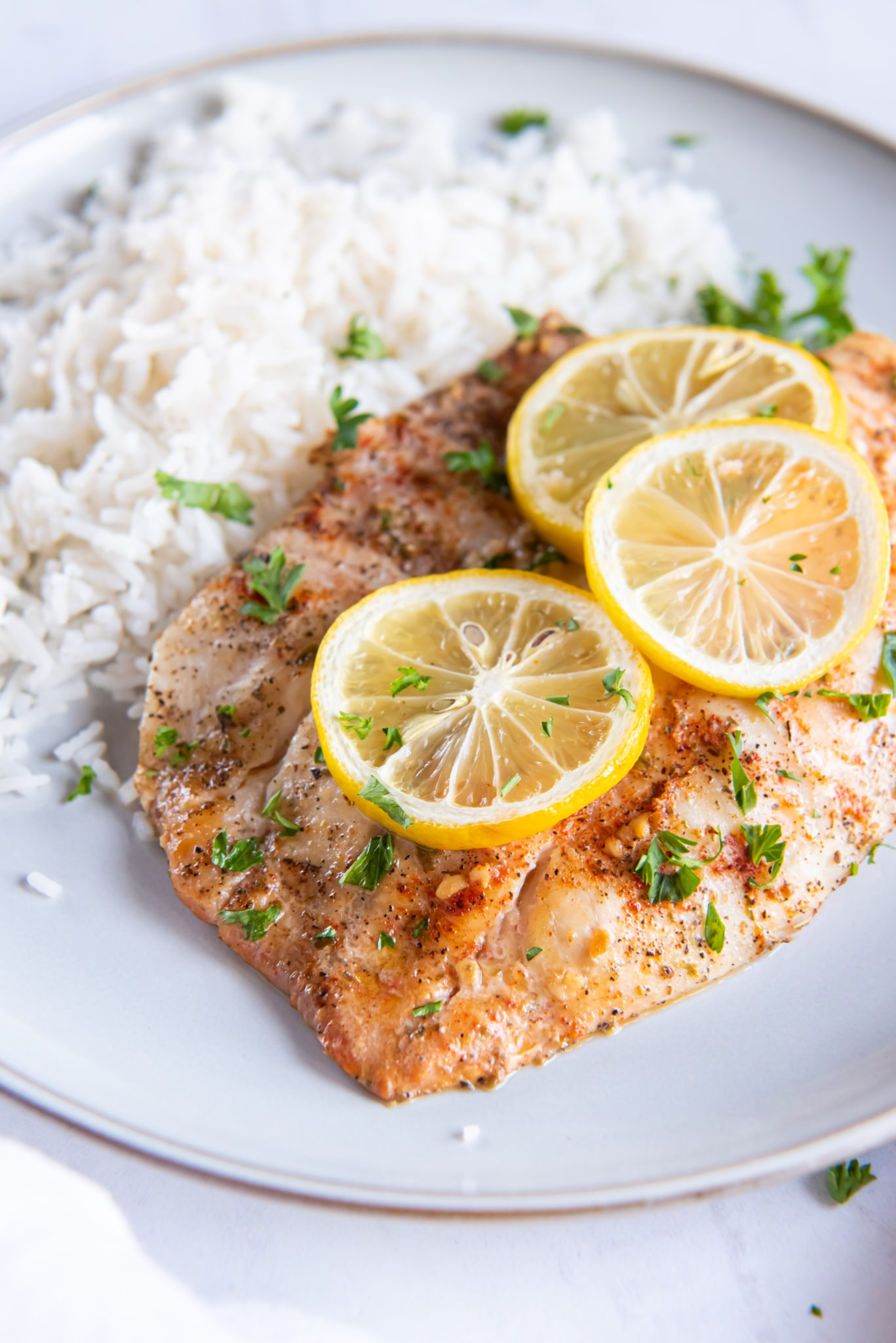 tilapia on a white plate