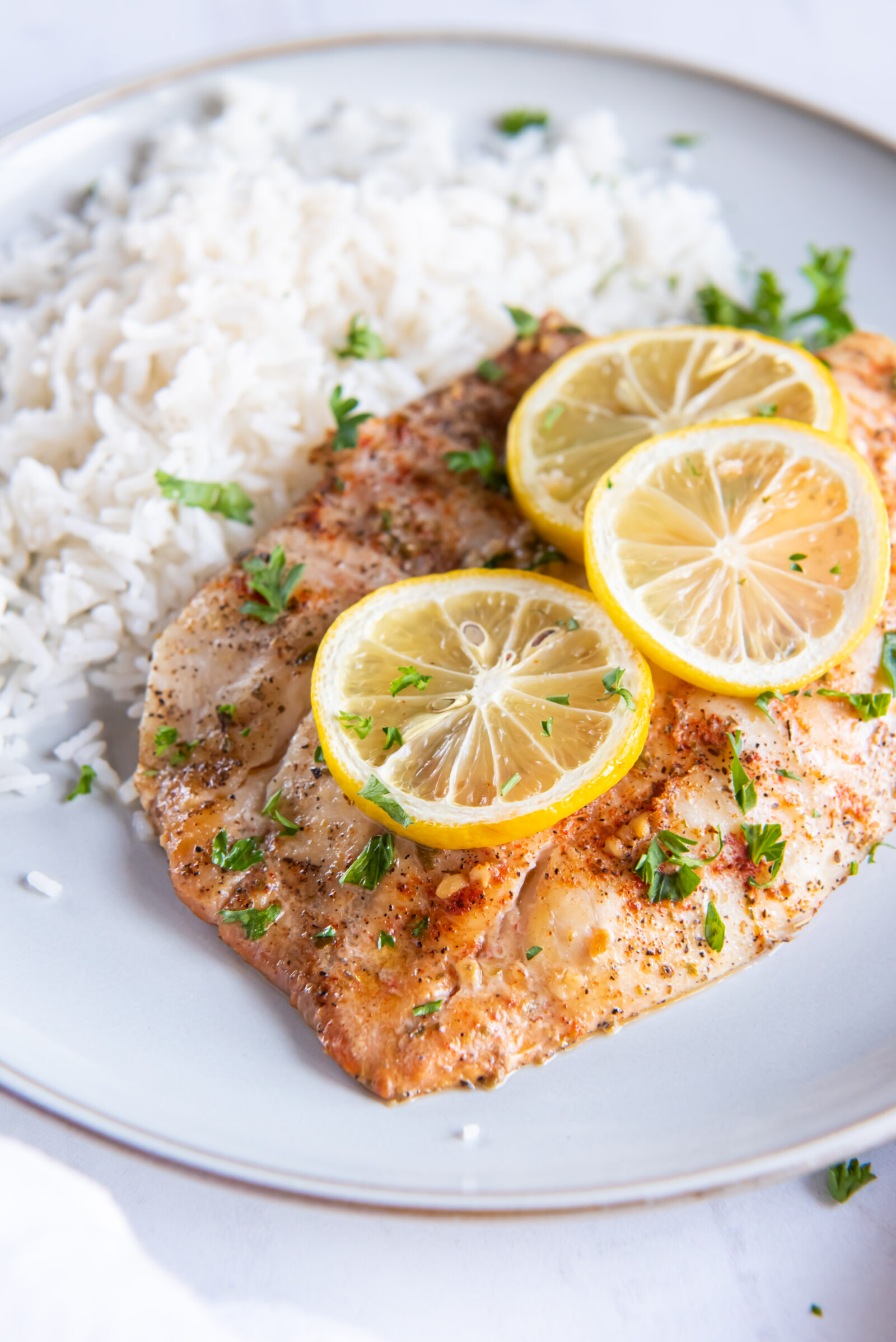 tilapia on a white plate