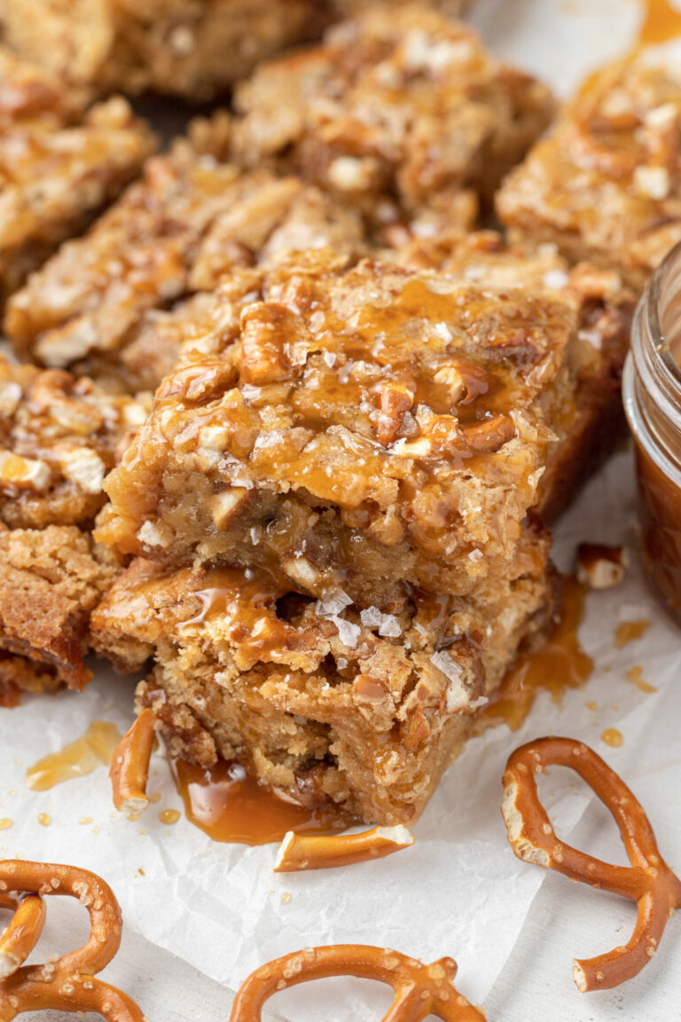 Salted Caramel Pretzel Blondies on a white surface.