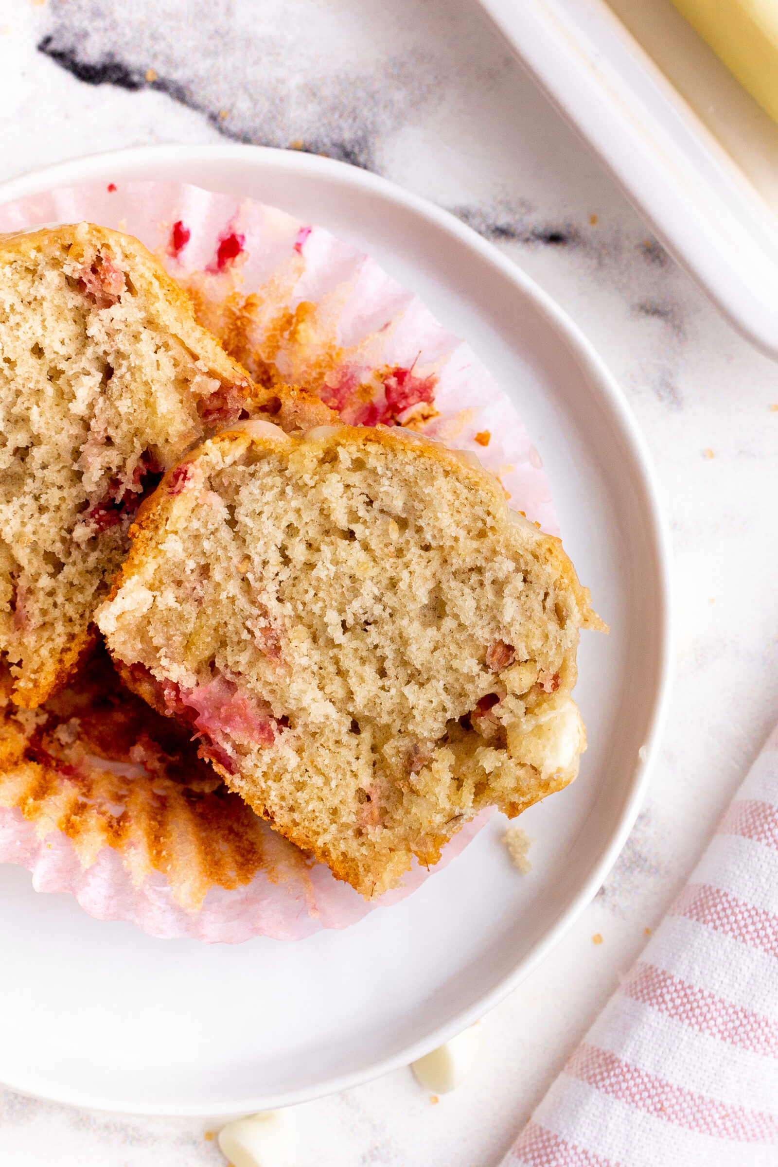 muffin cut in half on a white plate