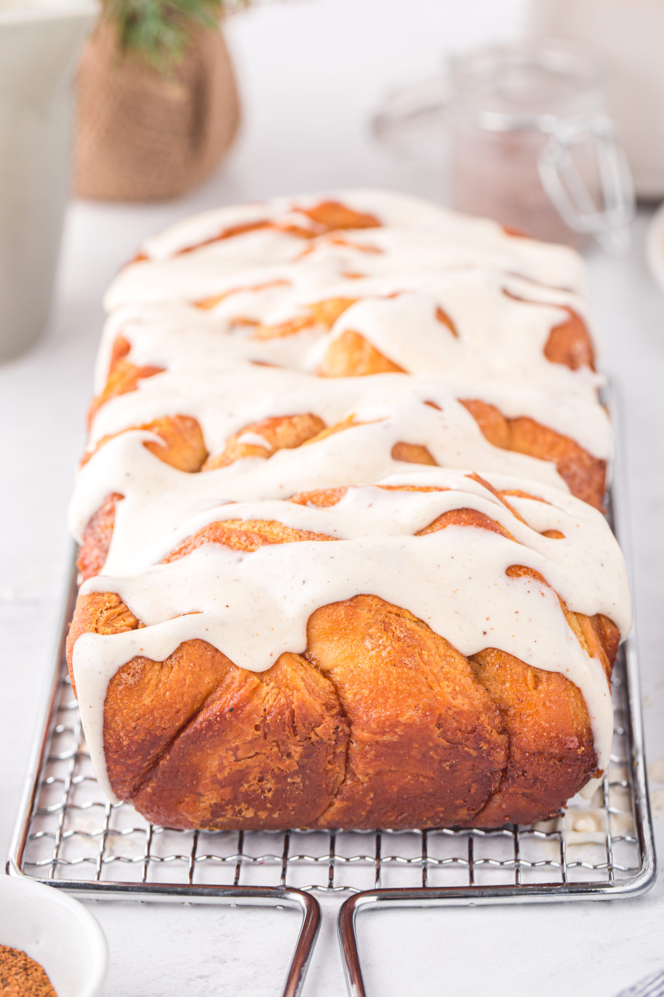 Christmas eggnog pull apart bread on a metal rack.