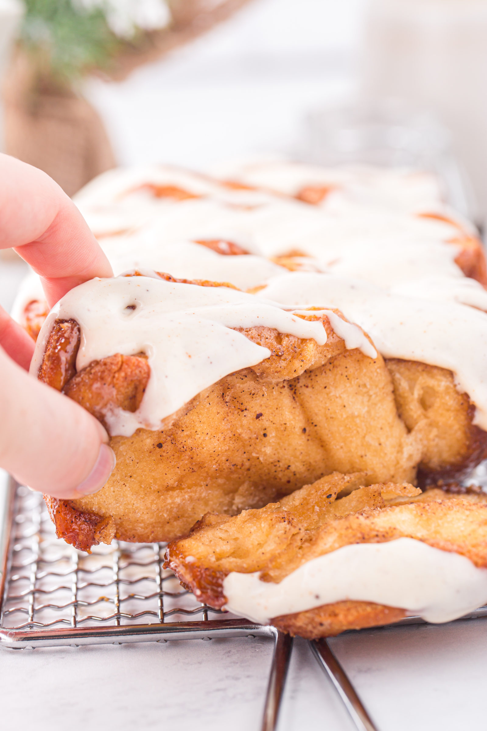 Eggnog bread being pulled apart. 