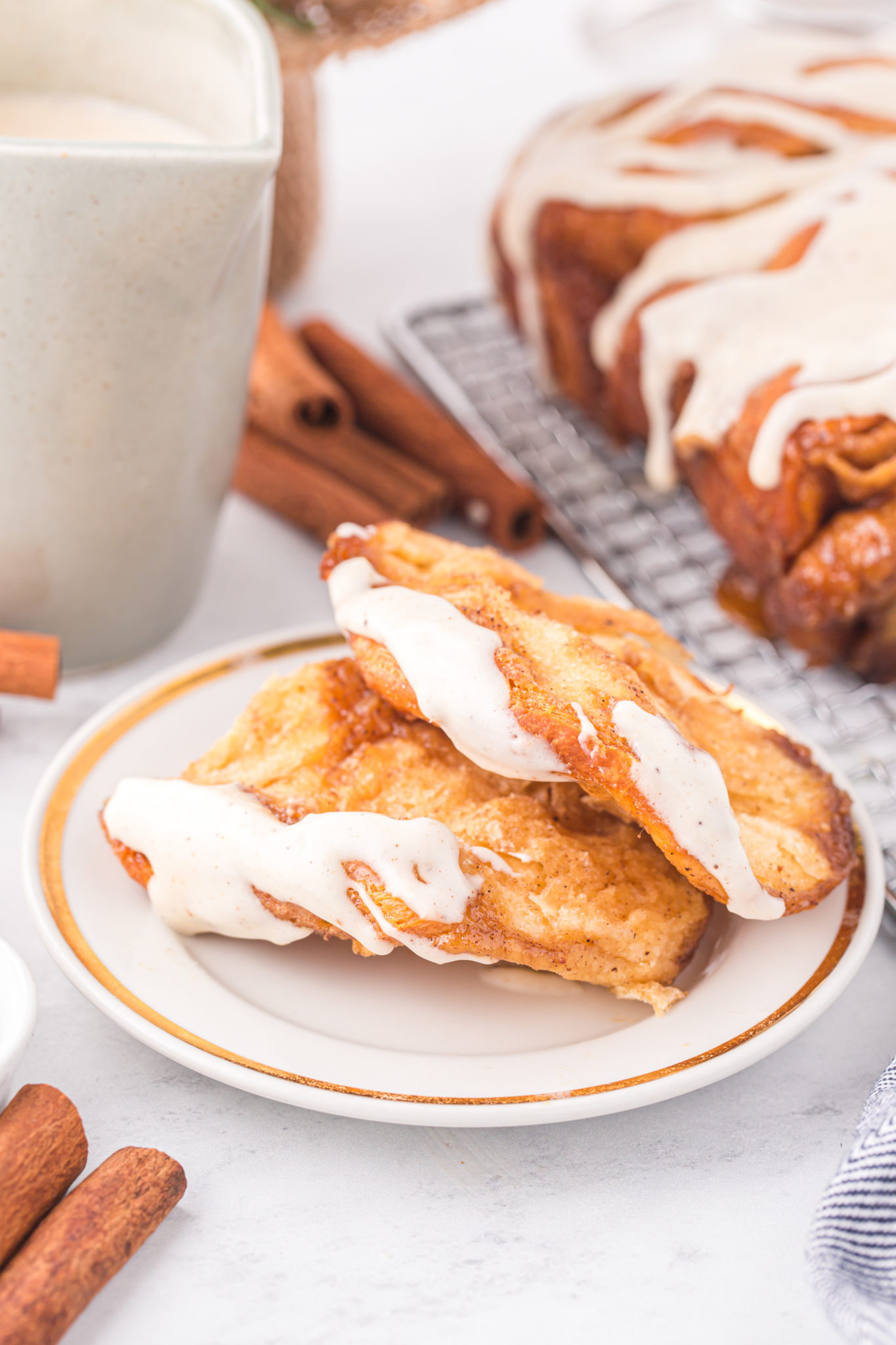 Two pieces of Christmas pull apart bread on a plate.