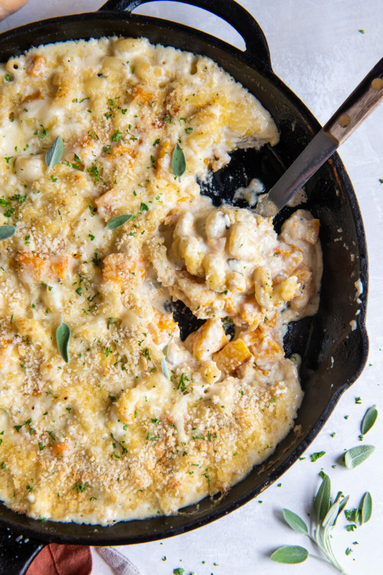 Overhead view of a skillet full of butternut squash mac and cheese.