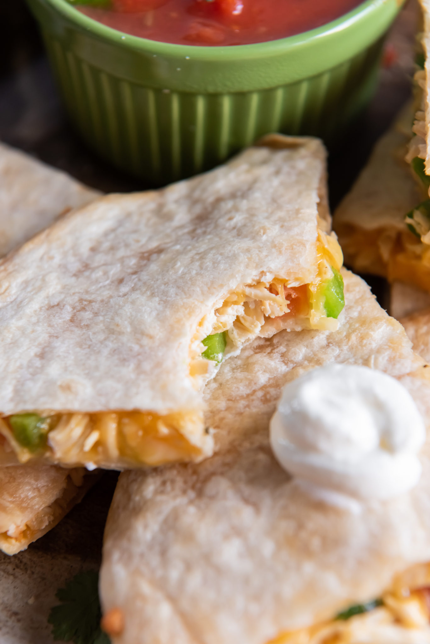 close up of a quesadilla with a bite missing