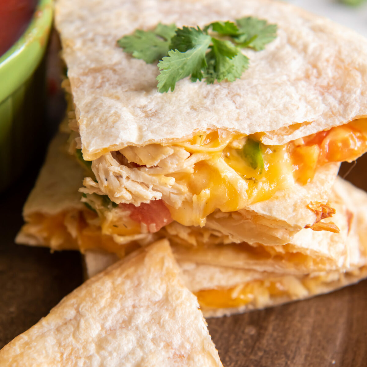 chicken quesadillas stacked on a plate