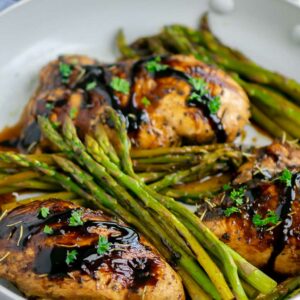 chicken and asparagus in a skillet