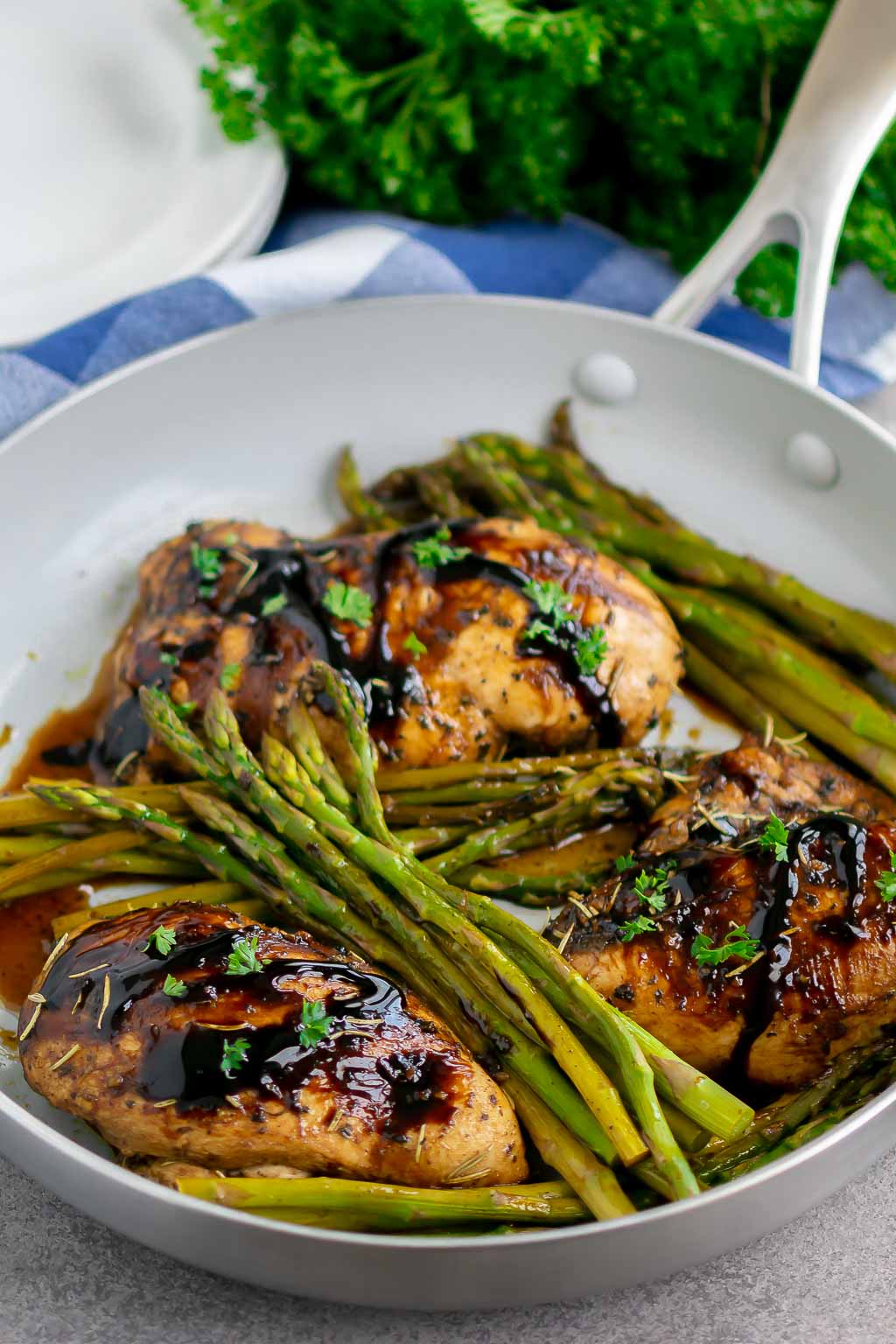 chicken and asparagus in a skillet