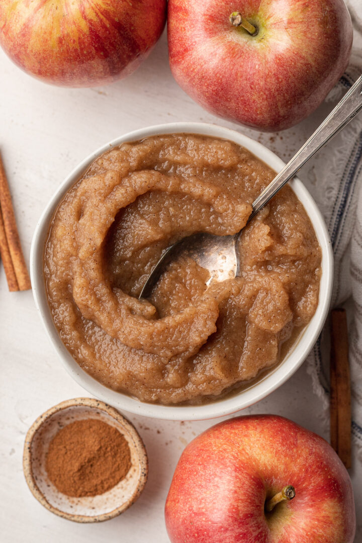 applesauce in a white bowl with a spoon