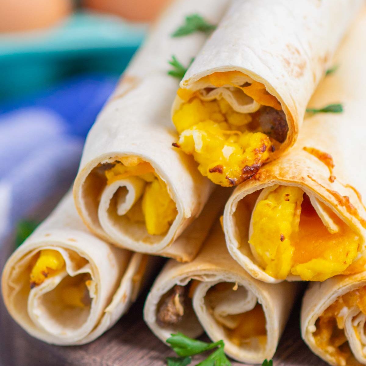 taquitos on a wooden serving board