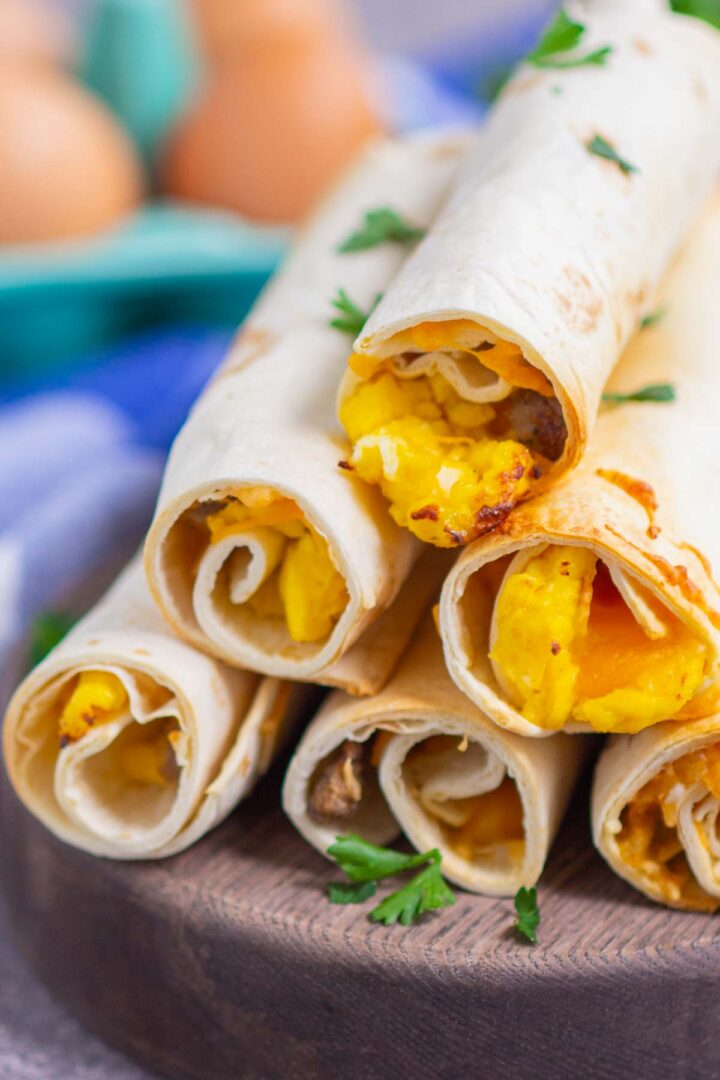 taquitos on a wooden serving board