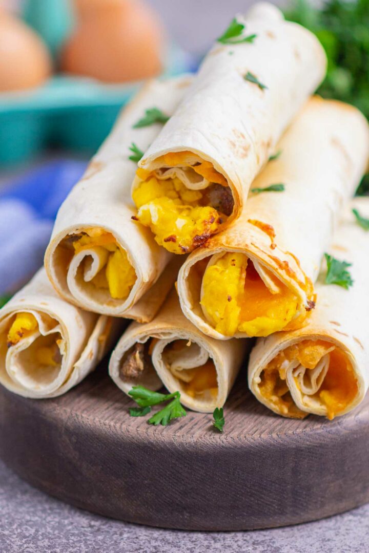 taquitos on a wooden serving board