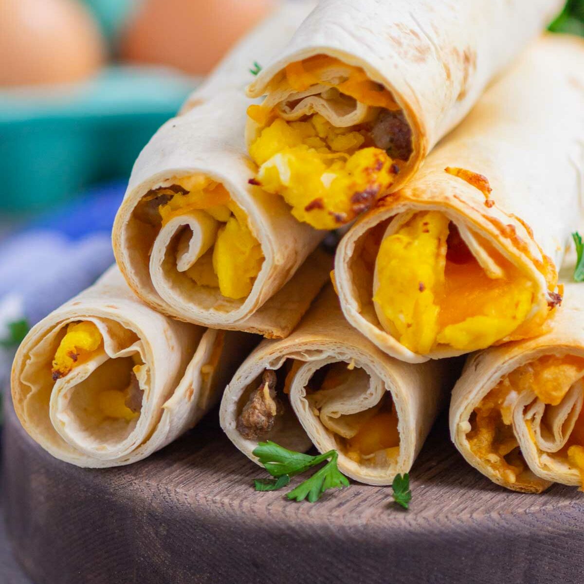 taquitos on a wooden serving board