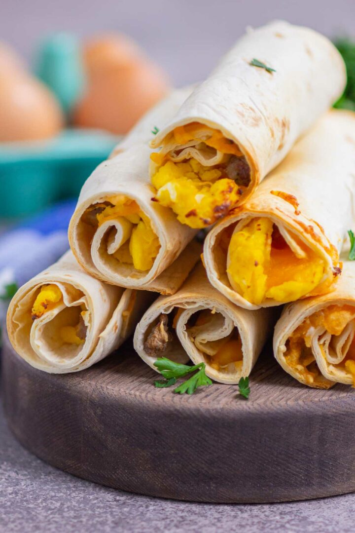 taquitos on a wooden serving board