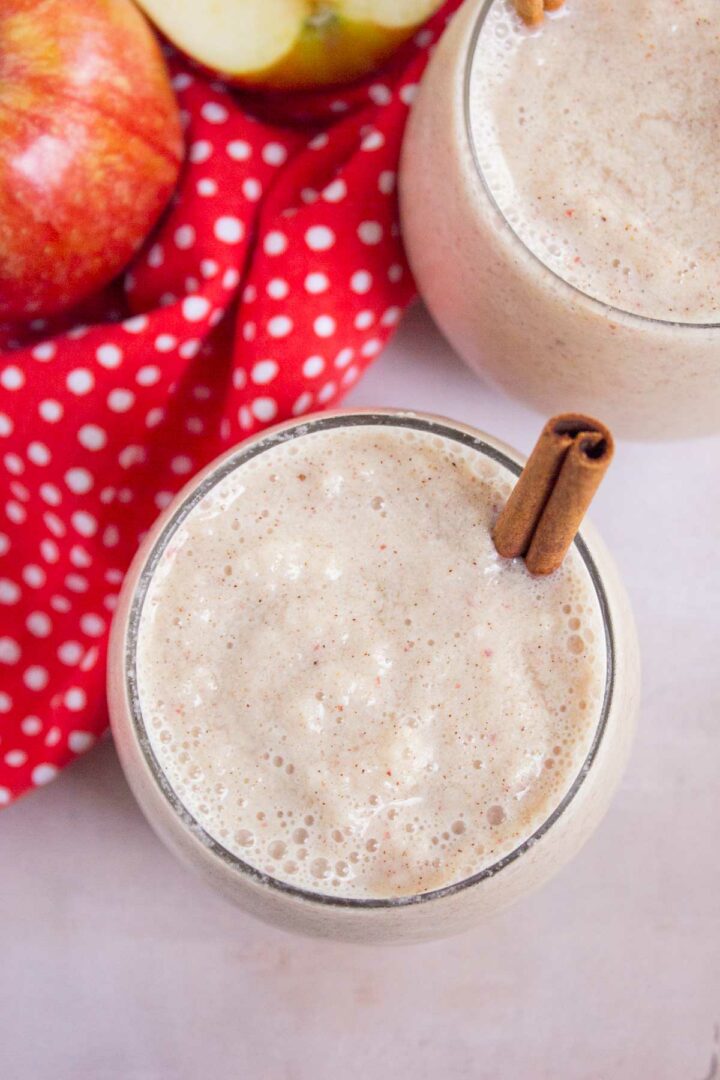 smoothie in a short glass with a cinnamon stick