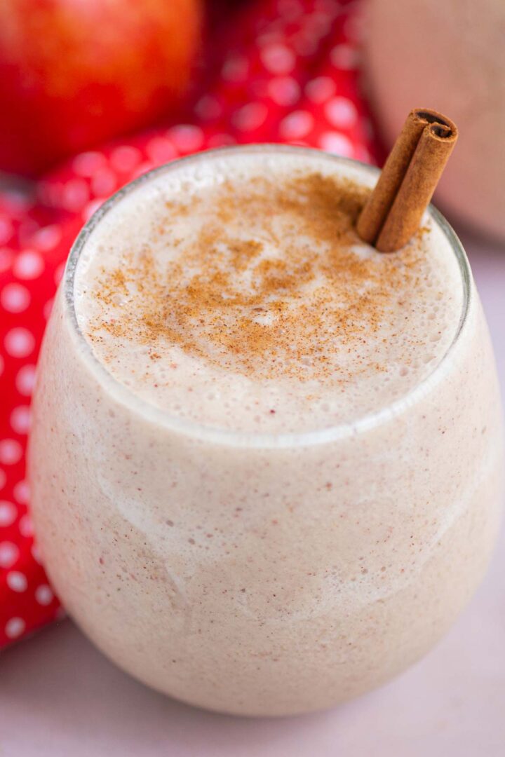 smoothie in a short glass with a cinnamon stick