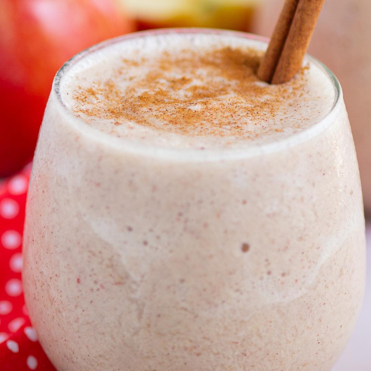 smoothie in a short glass with a cinnamon stick