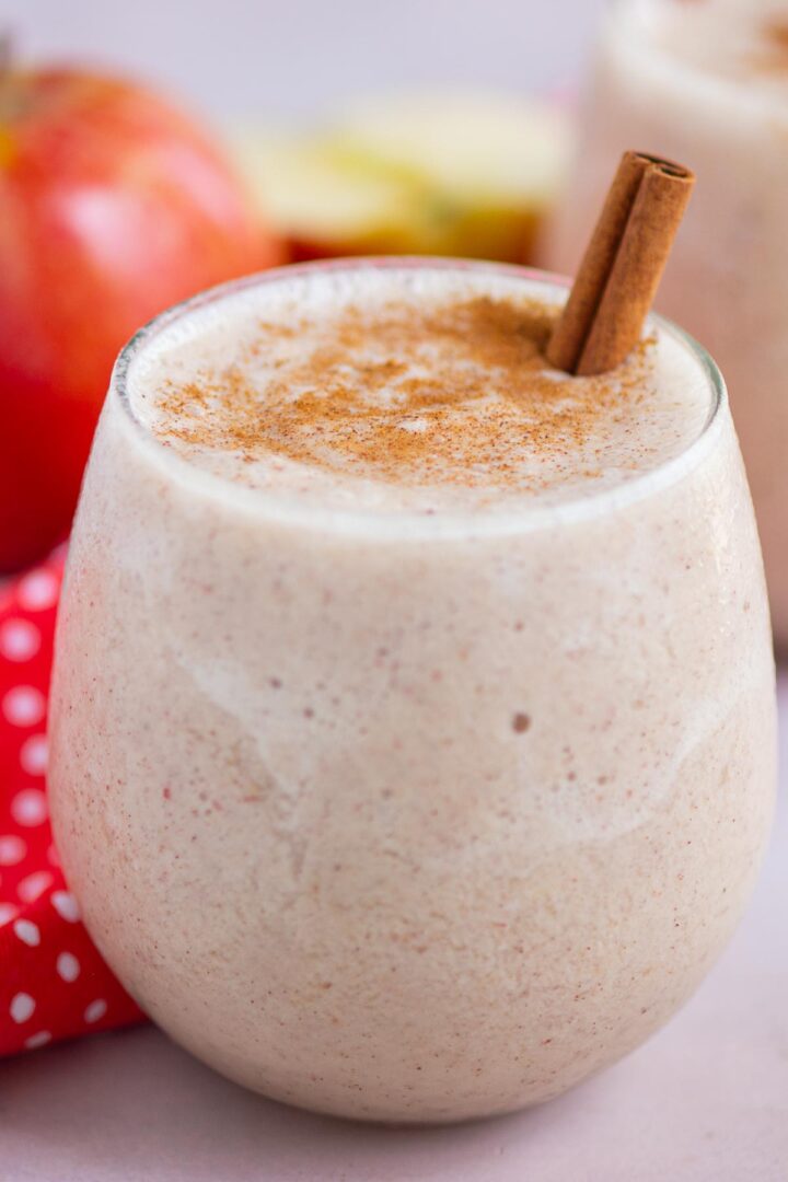 smoothie in a short glass with a cinnamon stick