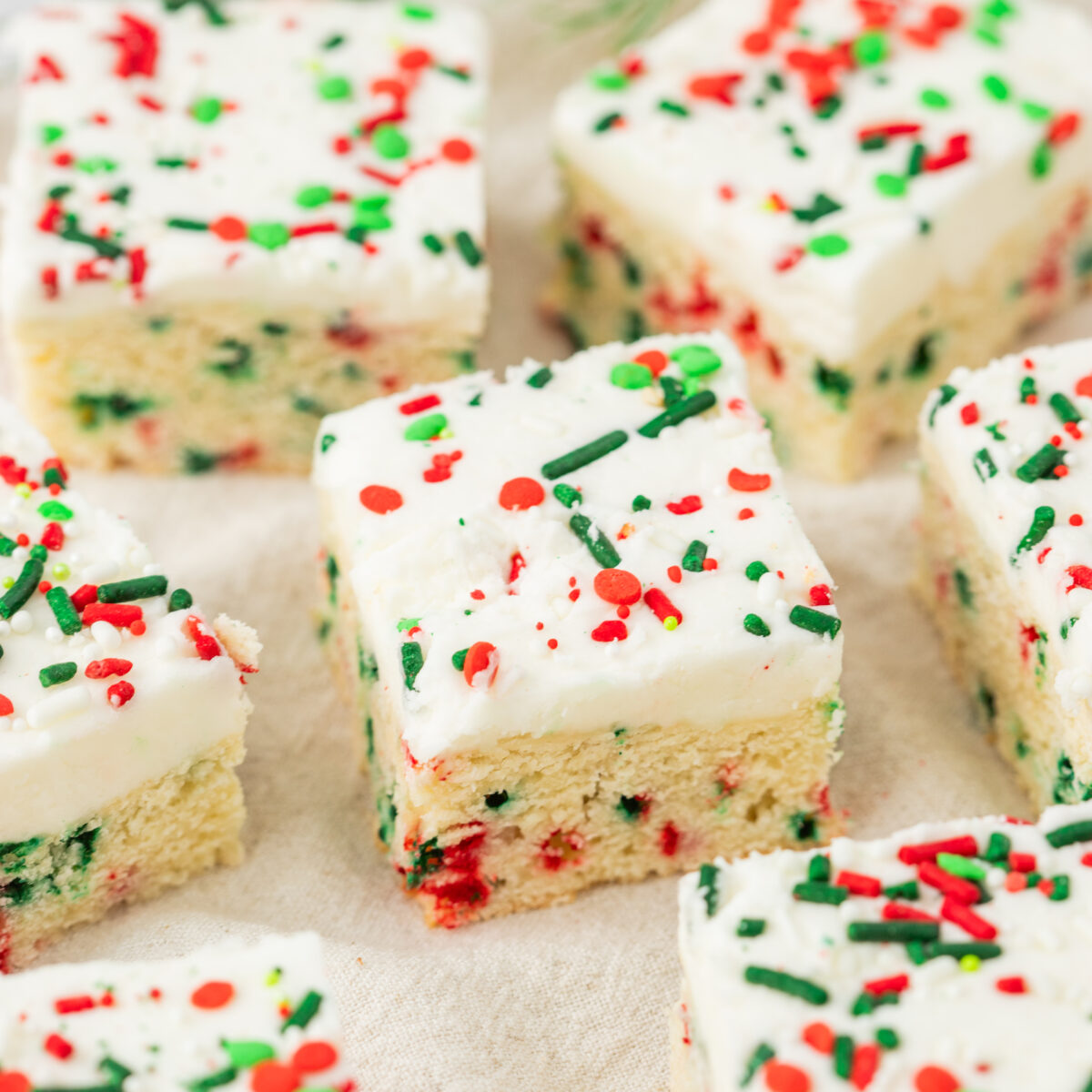 cookie bars spread out on a white surface