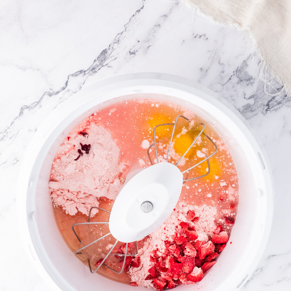 strawberry cake ingredients in a white bowl