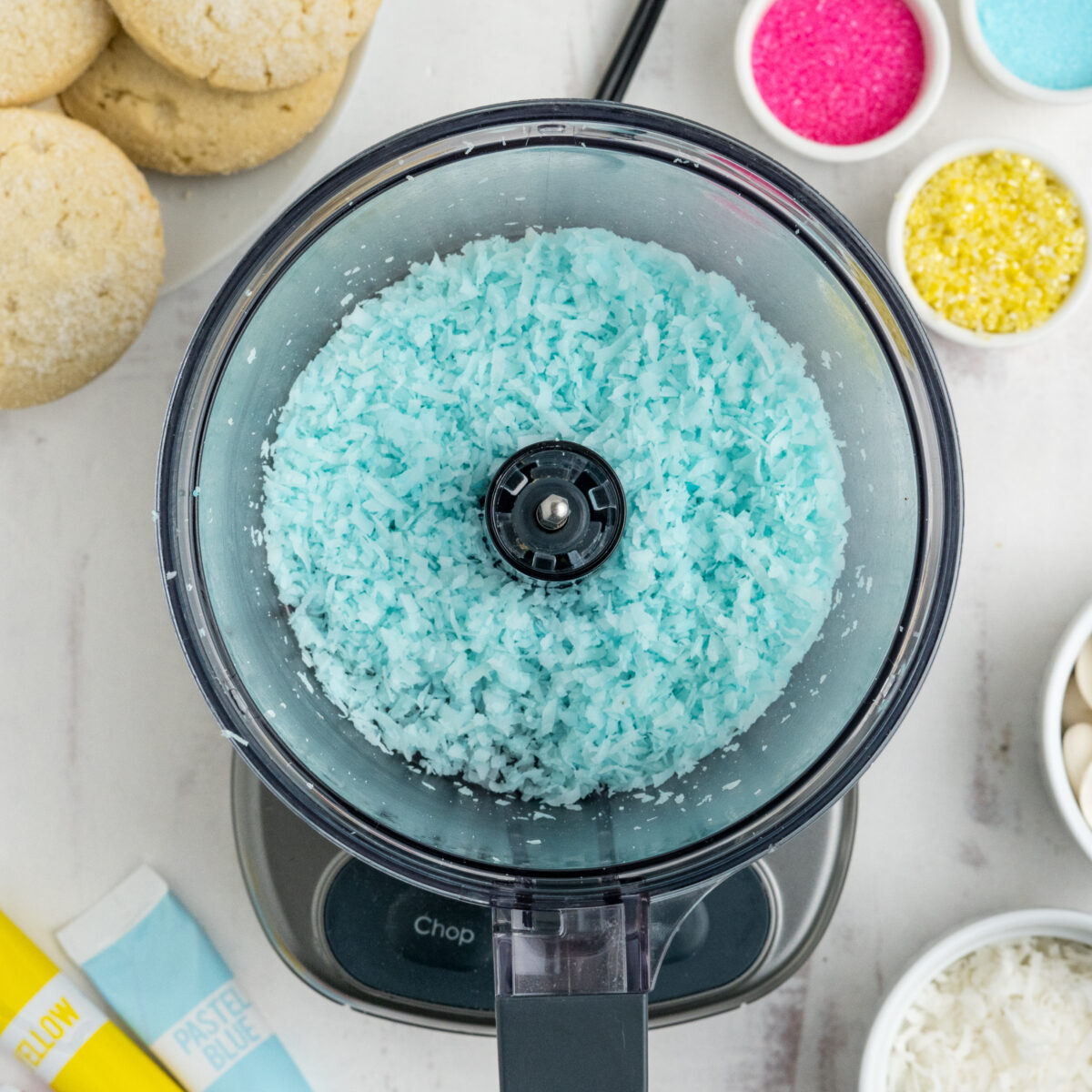 blue shredded coconut in a food processor