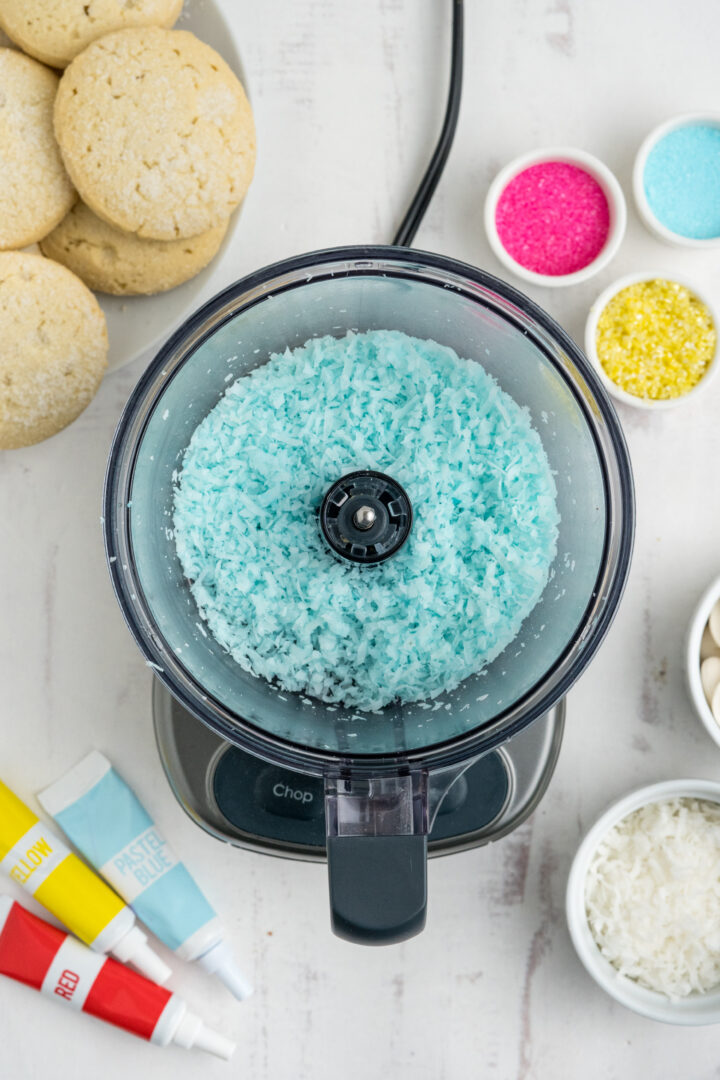 blue shredded coconut in a food processor