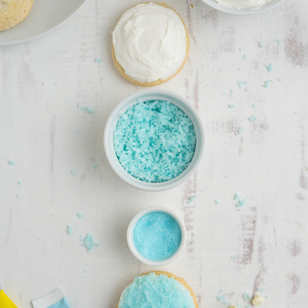 blue shredded coconut in small white bowls