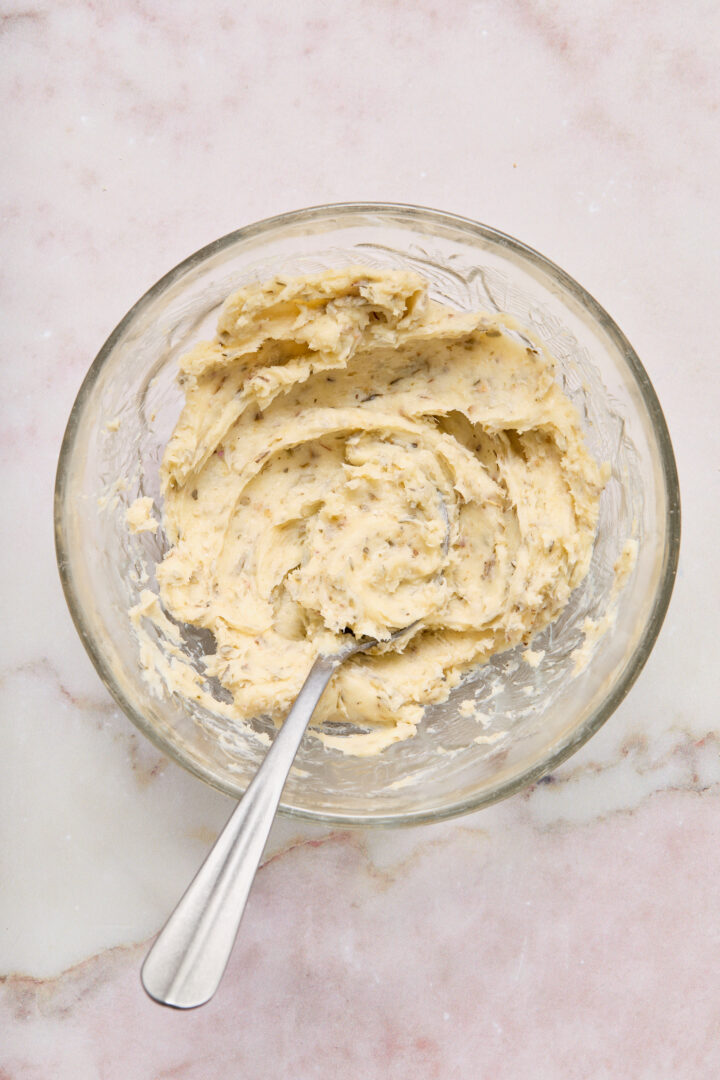garlic butter spread in a clear glass bowl