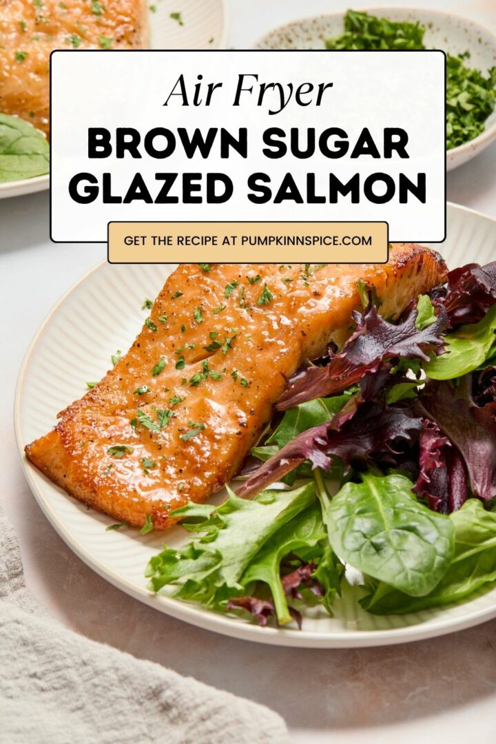 salmon and green lettuce on a white plate