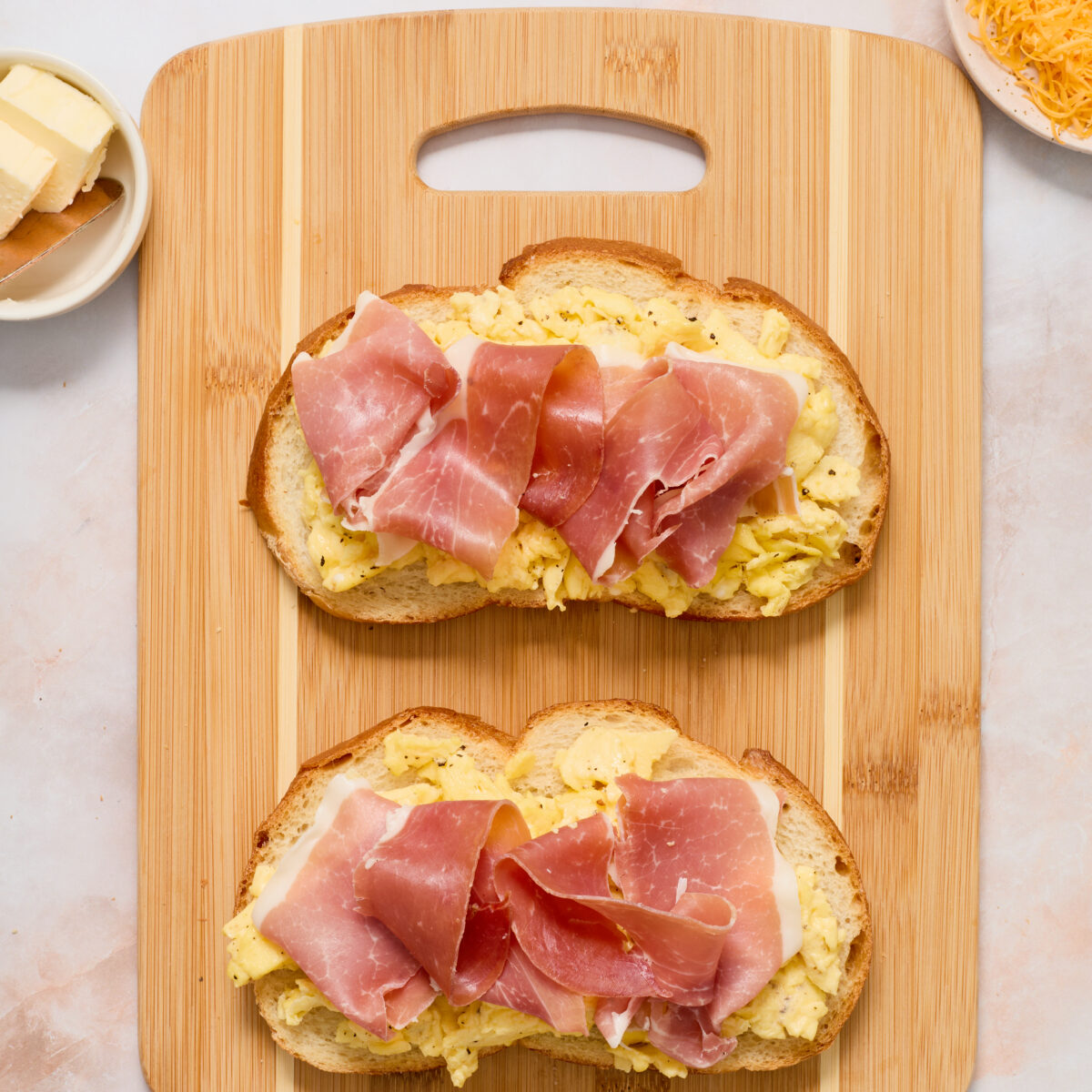 open-faced panini with eggs, prosciutto