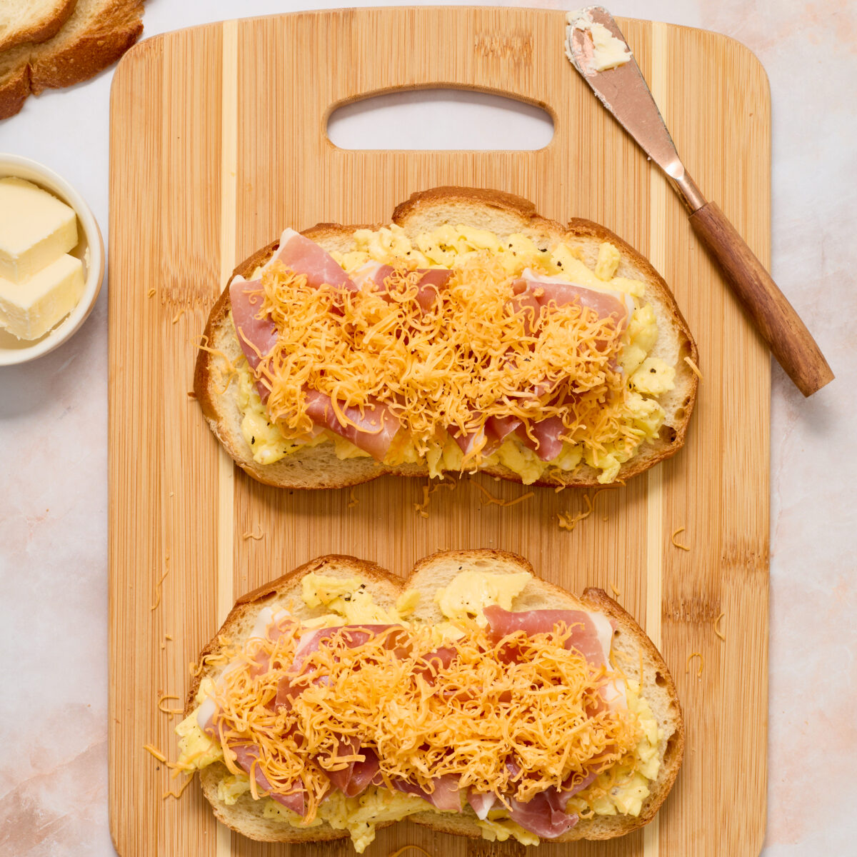 open-faced panini with egg, prosciutto, cheese