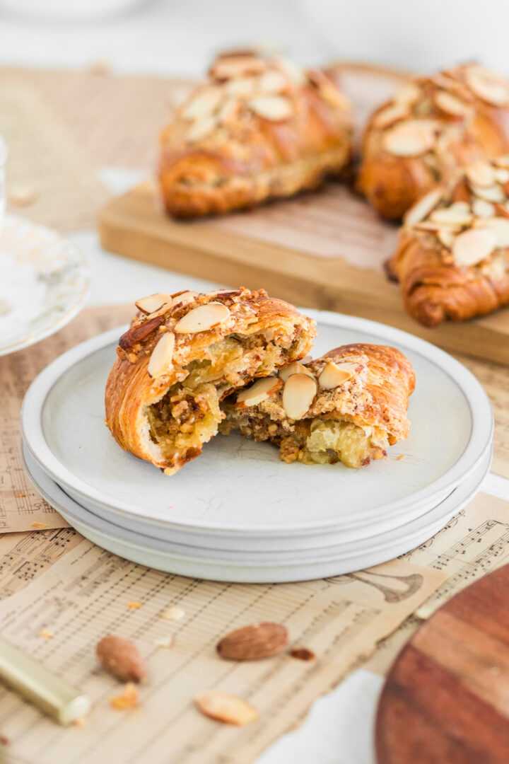 croissant cut in half on a white plate