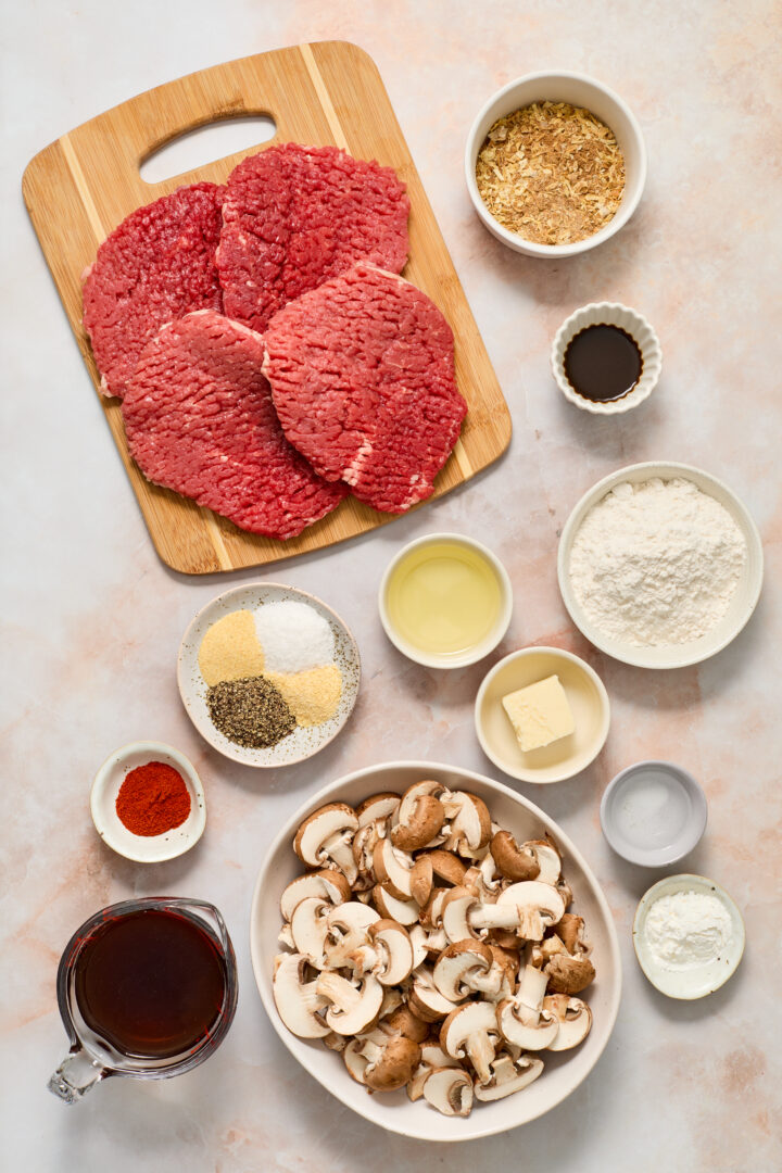 cube steak ingredients on a light pink surface