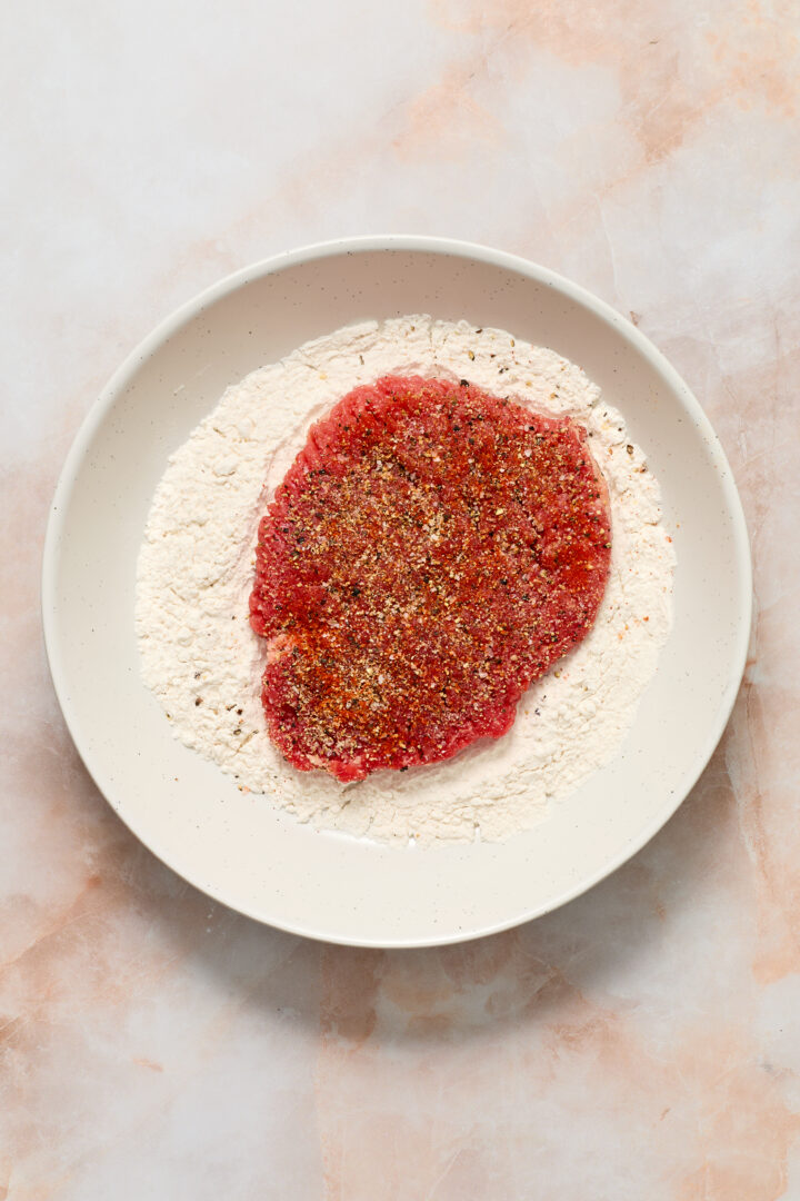 raw steak in flour