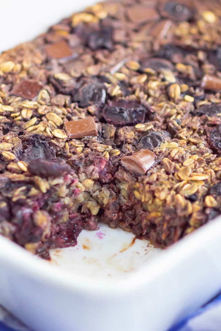 oatmeal bake in a white dish with a piece missing