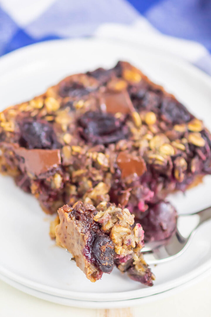 oatmeal slice on a white plate with a bite on a silver fork