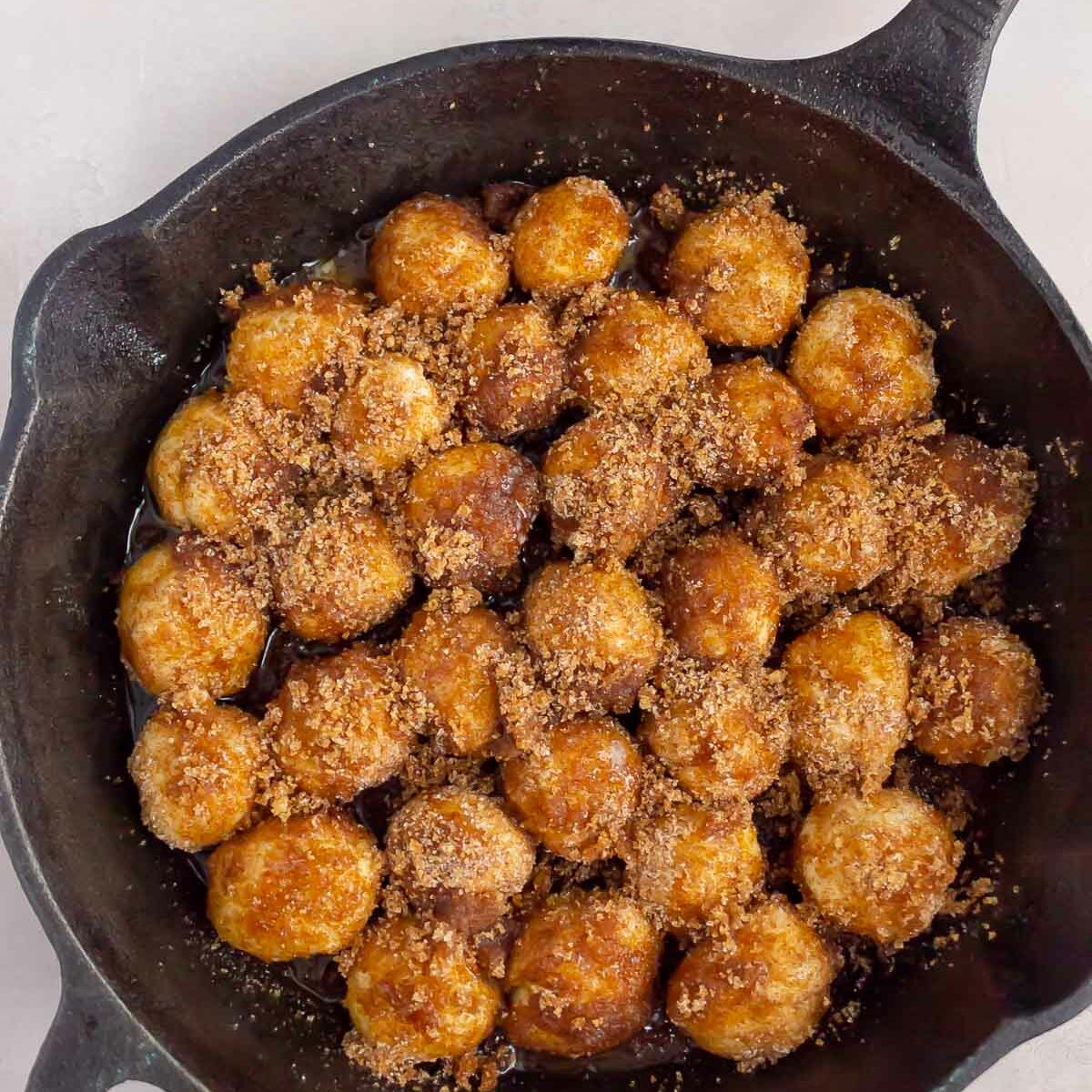 monkey bread in a cast iron skillet before being baked